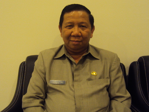 Adrianus Nixon Watung SH